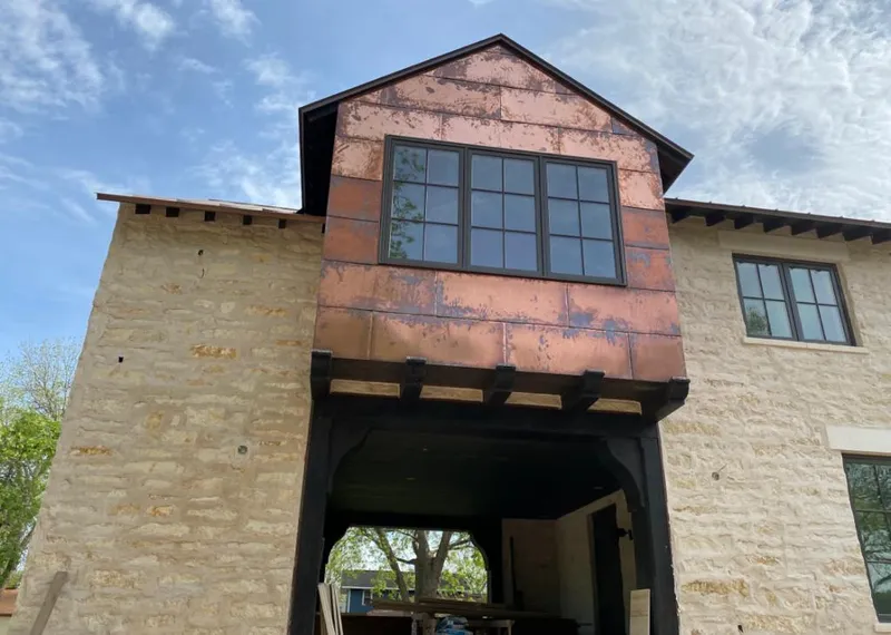 Copper metal panel facade on a stone building for Skylight Installation in Buckeye