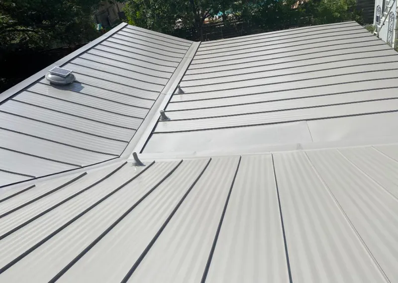 Solar attic fan installed on a metal roof for Roof Ventilation in Buckeye
